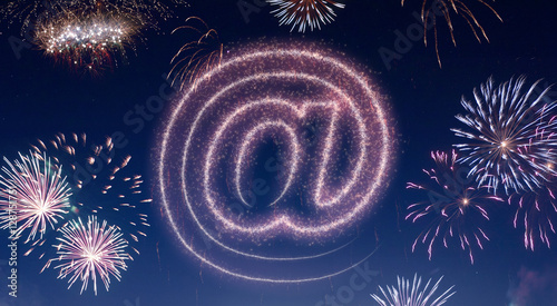 Night sky with fireworks shaped as an at symbol.(series)