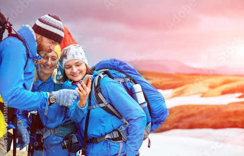 couple hikers un the Islandic mountains photo