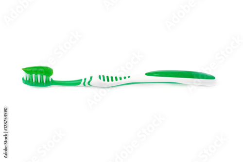 Green toothbrush with paste isolated over white background