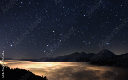 Orion over the clouds photo