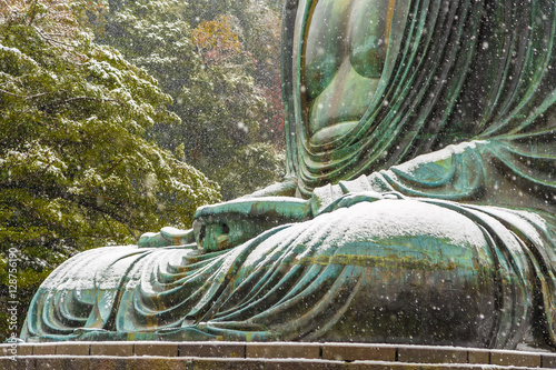 The Great Buddha in Kamakura.It's snowing.  Located in Kamakura, Kanagawa Prefecture Japan.