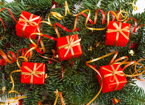 Christmas or New Year background: fur-tree, branches, gifts, decoration on a white background
