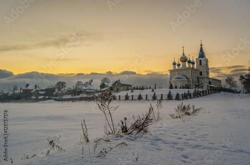 church Saint Michaels in Bolshoye Kozino Nizhny Novgorod region Russia at the sunset of 26 november 2016 photo