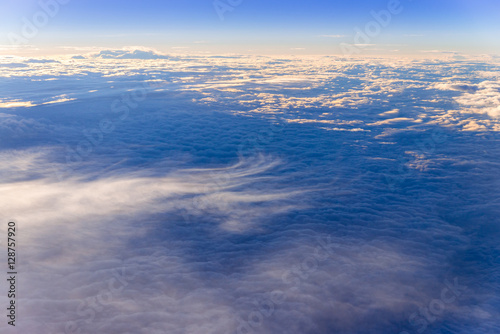 the sea of clouds sunset sky background, view from the window of