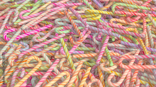 A mesy pile of colorful candy canes. This image is a 3D illustration. photo