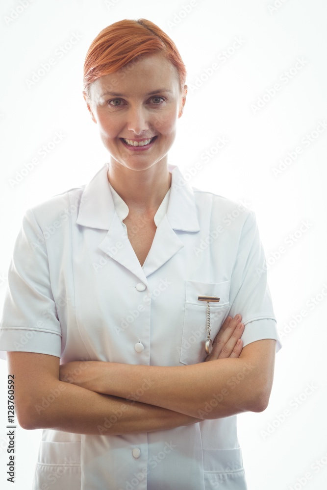 Portrait of a smiling nurse crossing arms Portrait of a smiling nurse crossing arms