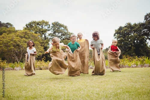 Canvas Print Children having a sack race