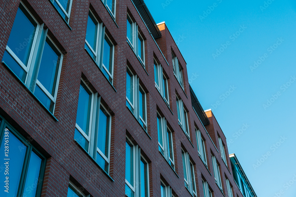 brick office building exterior in low angle view