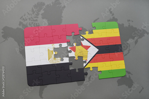 puzzle with the national flag of egypt and zimbabwe on a world map.