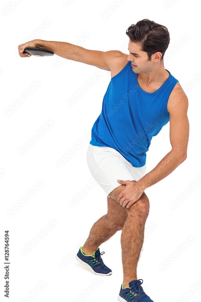Fototapeta premium Male athlete playing discus throw on white background