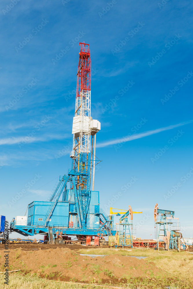 Land oil drilling rig blue sky