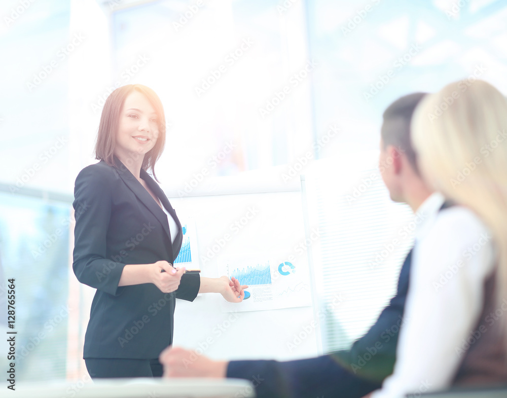 Businesswoman asking question during her colleagues presentation Businesswoman asking question during her colleagues presentation