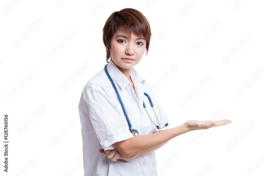 Asian young female doctor show something on her hand. Asian young female doctor show something on her hand.