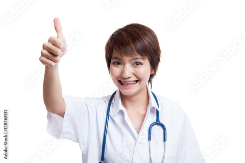 Young Asian female doctor show thumbs up.