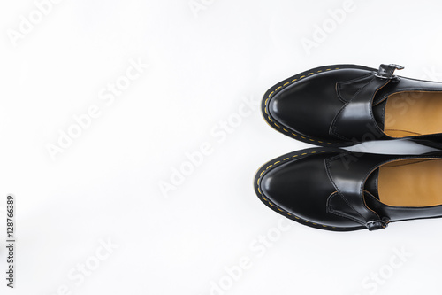 fashion female black shiny leather shoes white background