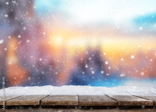 Empty wooden planks with abstract winter background