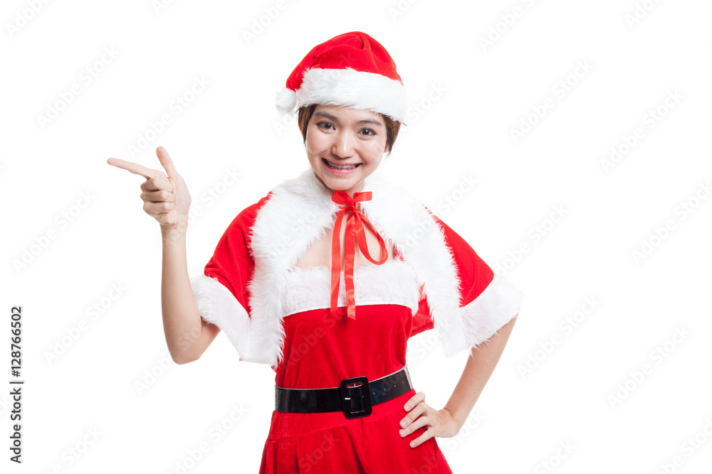 Asian Christmas Santa Claus girl point to blank space. Asian Christmas Santa Claus girl point to blank space.