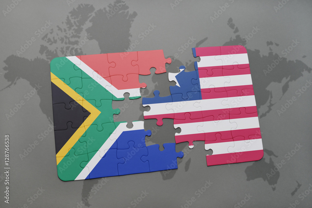 Obraz premium puzzle with the national flag of south africa and liberia on a world map.