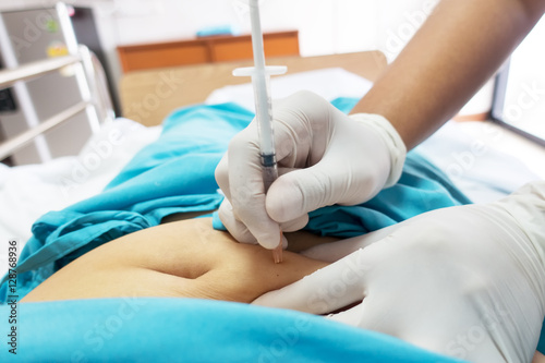 Injection into the abdominal at hospital/sickness