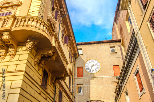 yellow balcony classic city clock building italy street architecture photo