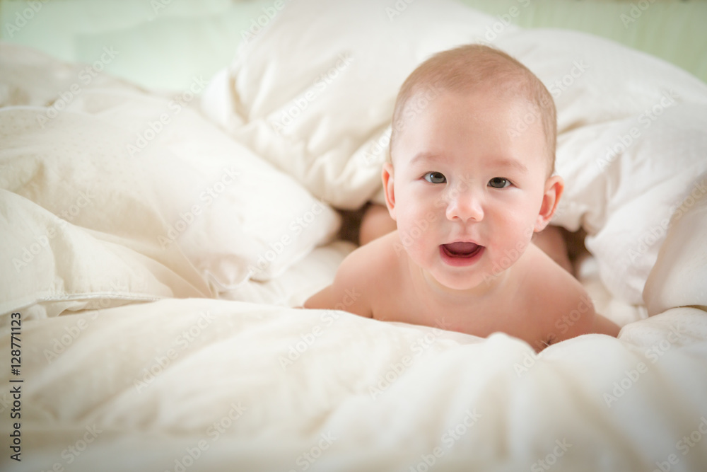 Young Mixed Race Chinese and Caucasian Baby Boy Having Fun on His Blanket.