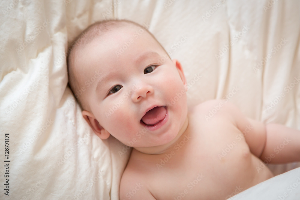 Young Mixed Race Chinese and Caucasian Baby Boy Having Fun on His Blanket.