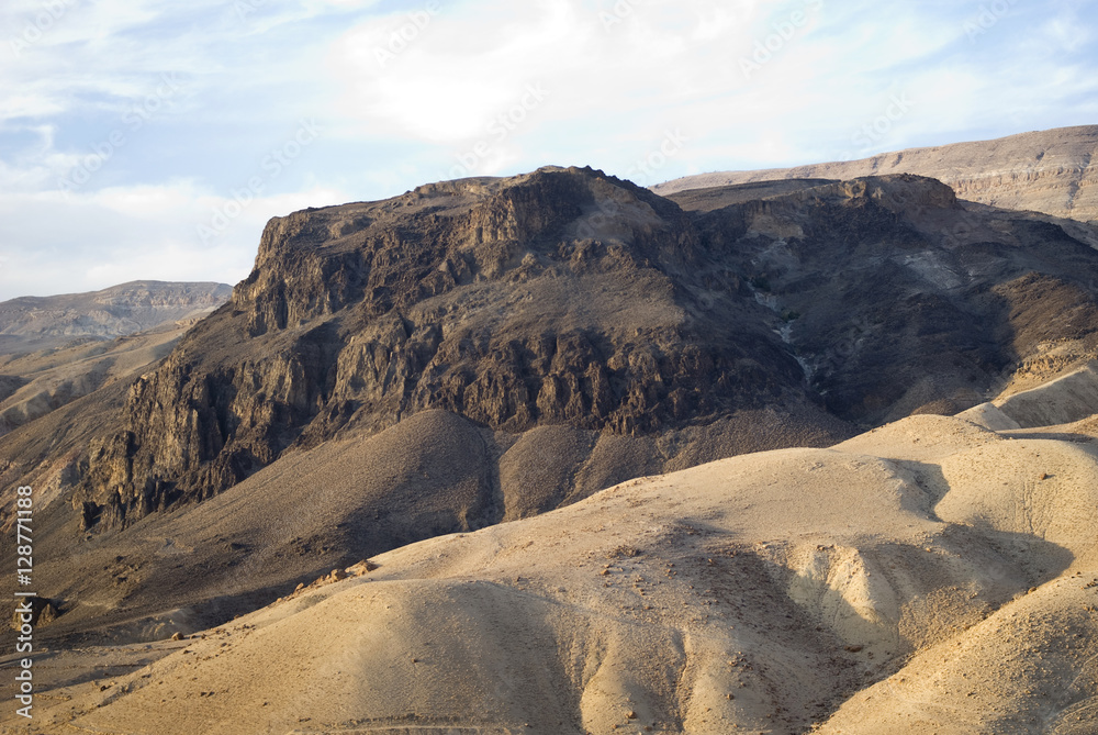 Volcanic plug rising through eroded sandstone near Wadi Hasa, Jordan