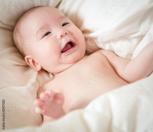 Young Mixed Race Chinese and Caucasian Baby Boy Having Fun on His Blanket.