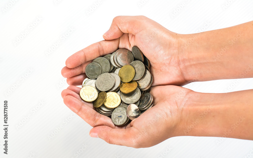 Hand stacking coins on white background Hand stacking coins on white background