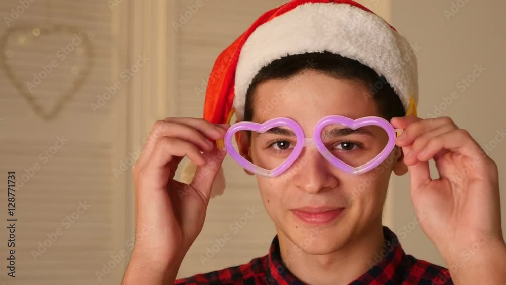 smiling young man wears glowing glasses smiling young man wears glowing glasses