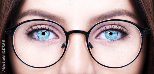 Beautiful young woman wearing glasses. Close-up shot