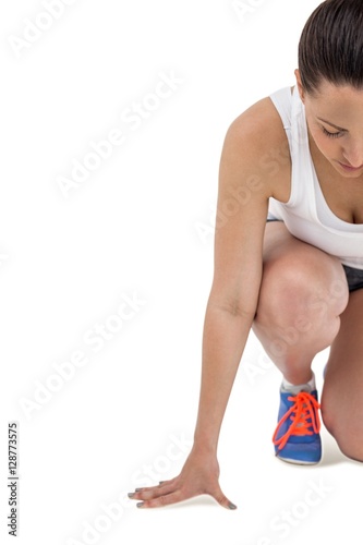 Athlete woman in ready to run position