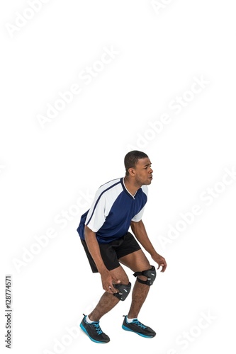 Sportsman posing while playing volleyball