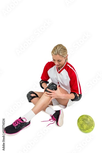Sportswoman wearing a knee pad
