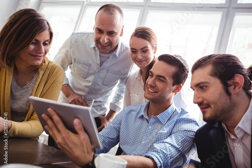 Business people using digital tablet