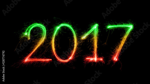 Happy New Year Rastaman - 2017 with sparklers on black background. Rastafarian Flag
