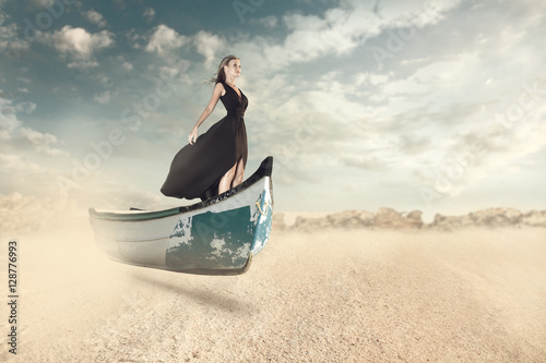 Fantasy portrait of young woman in the boat