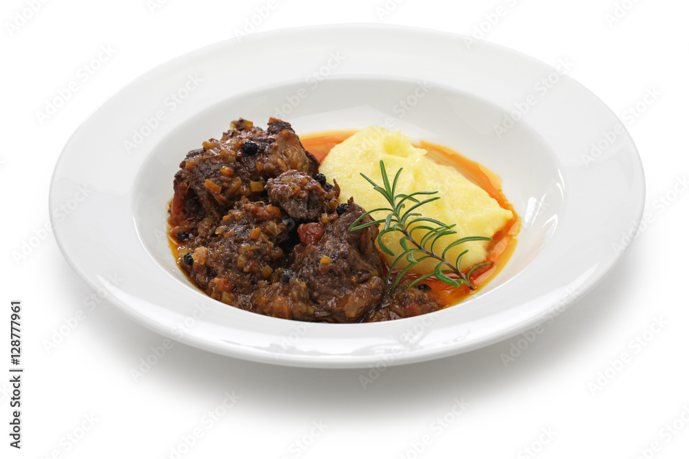 peposo with polenta, tuscan peppered beef stew, traditional italian cuisine peposo with polenta, tuscan peppered beef stew, traditional italian cuisine