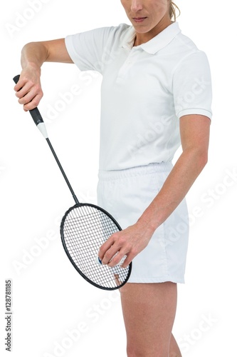 Female athlete holding a badminton racquet ready to serve  © WavebreakmediaMicro