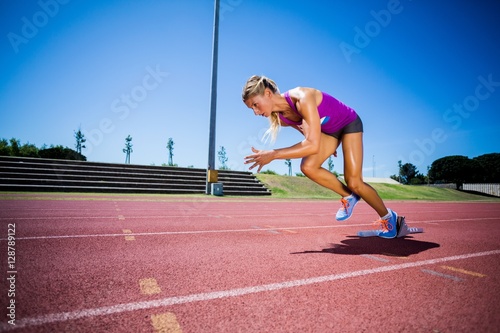 Female athlete running on the racing track © WavebreakmediaMicro
