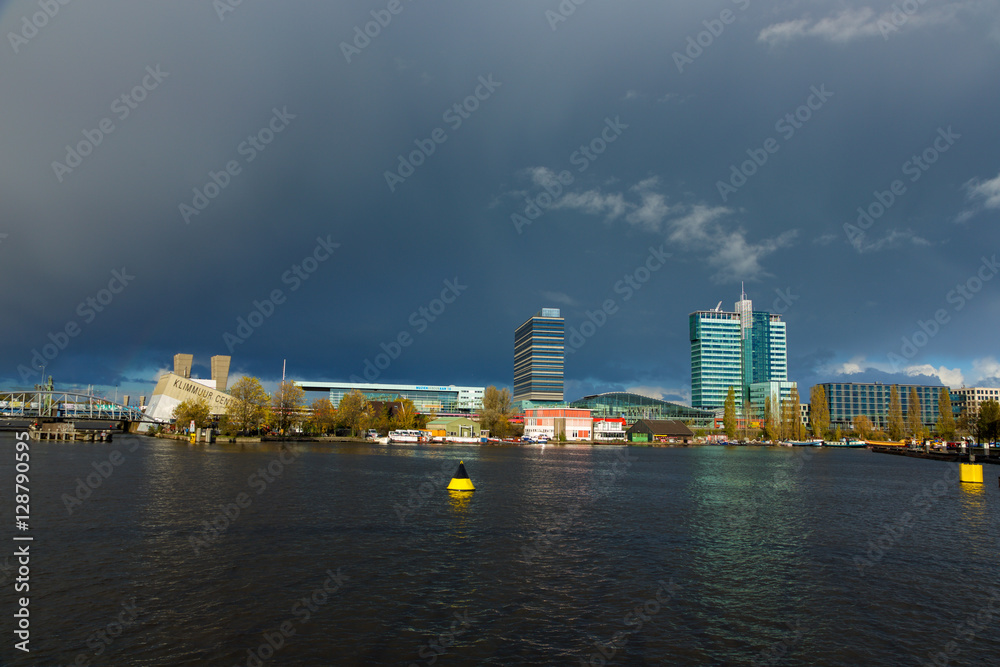 Dark clowds over the Oosterdok in Amsterdam. Dark clowds over the Oosterdok in Amsterdam.