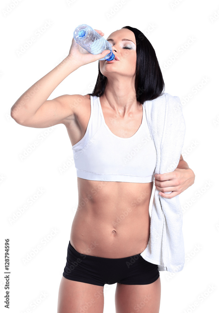 happy smiling woman in sportswear drinking water, isolated over white background happy smiling woman in sportswear drinking water, isolated over white background