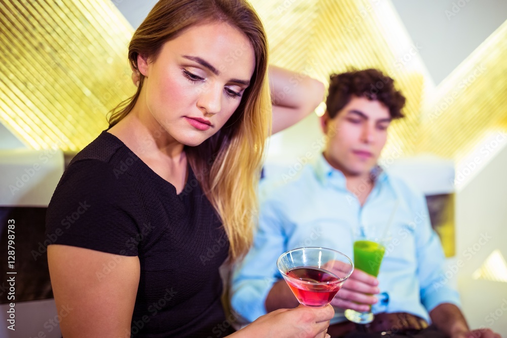 Couple holding cocktail glasses