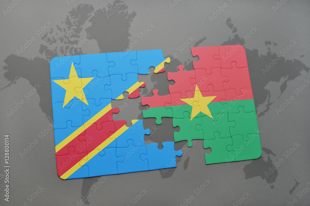Obraz premium puzzle with the national flag of democratic republic of the congo and burkina faso on a world map