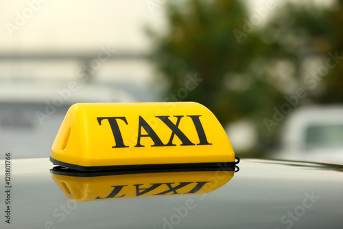 Taxi car on street, close up view