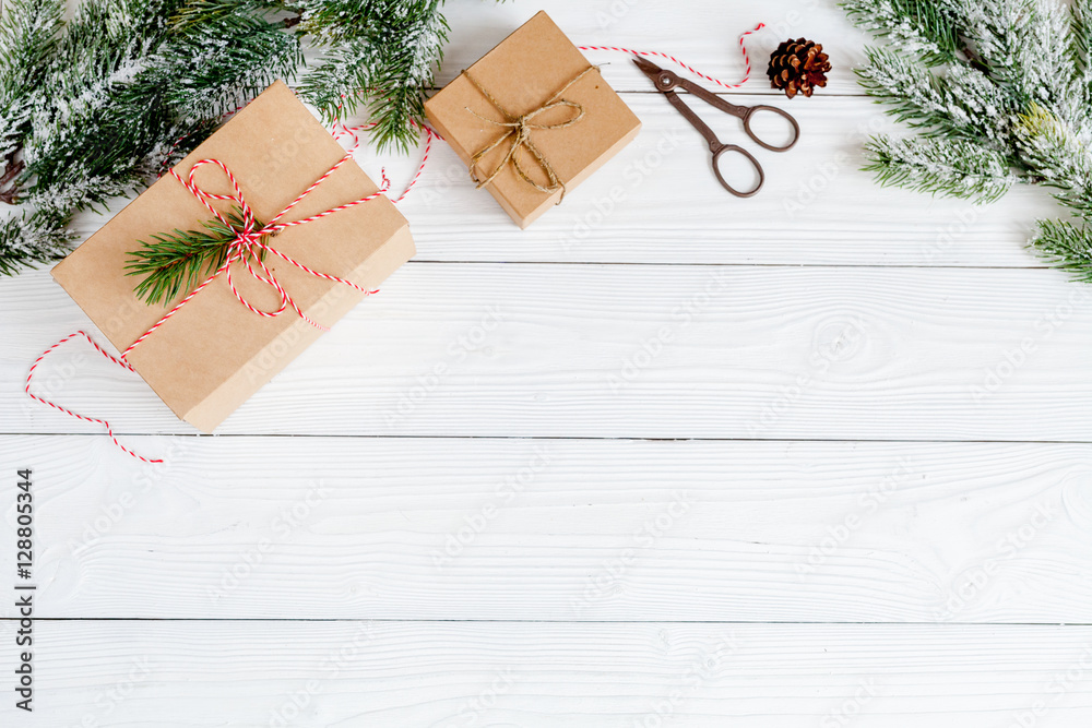 gifts boxes with fir branches on wooden background top view gifts boxes with fir branches on wooden background top view