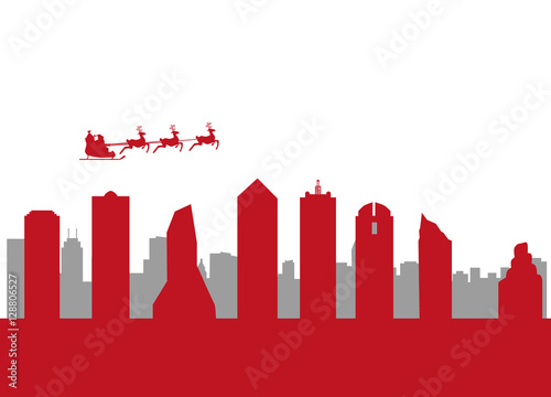 santa flying over the city of dallas