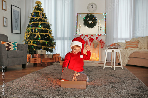 Cute little boy in Santa ha...