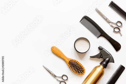 combs and hairdresser tools on white background top view