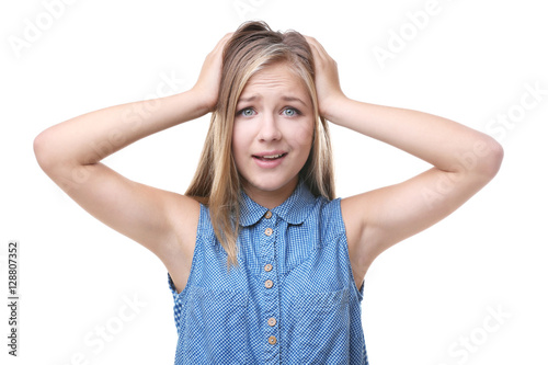 Confused teenager girl isol...